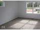 Bedroom with carpet and view of partially built new construction at 1817 Real St, Indianapolis, IN 46240