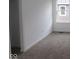 Neutral bedroom with soft carpet, a large window, and an open closet space provides comfortable living at 1817 Real St, Indianapolis, IN 46240