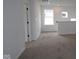 Upstairs hallway with white walls and neutral carpet at 1817 Real St, Indianapolis, IN 46240