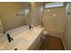 Well-lit bathroom featuring a double sink vanity with contemporary fixtures and a shower-tub combination at 1821 Real St, Indianapolis, IN 46240
