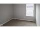 Comfortable bedroom with neutral carpeting, a bright window, and ample space for furniture at 1821 Real St, Indianapolis, IN 46240