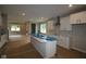 Open kitchen featuring white cabinets, a large island, and modern fixtures, great for entertaining at 1821 Real St, Indianapolis, IN 46240