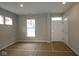 Bright living room featuring large windows and a freshly painted interior, ready for customization at 1821 Real St, Indianapolis, IN 46240