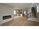 Spacious open-concept living area showcasing a modern fireplace, kitchen, and staircase, perfect for gatherings at 1821 Real St, Indianapolis, IN 46240