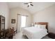 Bright bedroom with a ceiling fan, neutral walls, and a cozy bed with white linens at 1872 Wellpark Dr, Westfield, IN 46074