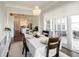 Well-lit dining room open to the kitchen with a lovely chandelier at 1872 Wellpark Dr, Westfield, IN 46074