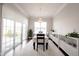 Bright dining room featuring sliding glass doors and an elegant chandelier at 1872 Wellpark Dr, Westfield, IN 46074