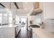 Bright kitchen features a center island with quartz countertop, stainless steel appliances, and subway tile backsplash at 1872 Wellpark Dr, Westfield, IN 46074