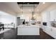 Eat-in kitchen with an island and stainless steel appliances that opens to the living room at 1872 Wellpark Dr, Westfield, IN 46074