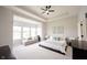 Spacious main bedroom with a cozy sitting area and tray ceiling at 1872 Wellpark Dr, Westfield, IN 46074