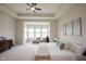 Light filled main bedroom with a sitting area and ceiling fan at 1872 Wellpark Dr, Westfield, IN 46074