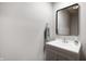 Bright bathroom featuring gray vanity, modern sink, framed mirror, and convenient towel holder at 2508 W Sun Valley Pkwy, Muncie, IN 47303