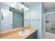 Bathroom features a shower, toilet, and a large mirror over the sink at 2508 W Sun Valley Pkwy, Muncie, IN 47303