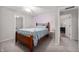 Bedroom boasts an oversized bed, carpet and connections to other rooms at 2508 W Sun Valley Pkwy, Muncie, IN 47303