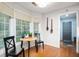 Cozy breakfast nook filled with light from bay windows and hardwood flooring at 2508 W Sun Valley Pkwy, Muncie, IN 47303