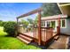 Cozy outdoor deck with a pergola and outdoor furniture, perfect for relaxing and entertaining at 2508 W Sun Valley Pkwy, Muncie, IN 47303