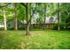 Charming home featuring lush landscaping and mature trees in a serene, picturesque setting at 2508 W Sun Valley Pkwy, Muncie, IN 47303