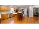 Bright kitchen with an island and breakfast bar, stainless steel appliances and hardwood floors at 2508 W Sun Valley Pkwy, Muncie, IN 47303