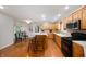 Open kitchen design with hardwood floors, island with seating and stainless steel appliances at 2508 W Sun Valley Pkwy, Muncie, IN 47303