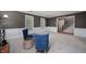 Inviting living room with neutral carpet and access to the staircase and hallway at 2508 W Sun Valley Pkwy, Muncie, IN 47303