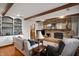 Spacious living room with brick fireplace, wood beams, built in shelves and hardwood floors at 2508 W Sun Valley Pkwy, Muncie, IN 47303