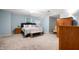 Main bedroom features a ceiling fan and an armoire at 2508 W Sun Valley Pkwy, Muncie, IN 47303