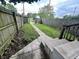 Backyard view from a concrete porch, with a concrete walkway and a wood fence at 2918 Ruckle St, Indianapolis, IN 46205