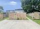 View of the spacious backyard with a broken wooden fence at 2918 Ruckle St, Indianapolis, IN 46205