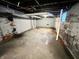 Unfinished basement with painted brick walls and exposed ceiling at 2918 Ruckle St, Indianapolis, IN 46205