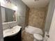 This bathroom features gray walls, a tub and shower combination, and a vanity at 2918 Ruckle St, Indianapolis, IN 46205