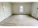 Clean bedroom featuring light gray walls and new grey vinyl flooring at 2918 Ruckle St, Indianapolis, IN 46205