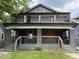 Gray duplex exterior with railings and covered porches at 2918 and 2920 address numbers at 2918 Ruckle St, Indianapolis, IN 46205