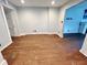 The living room featuring hardwood floors and openings to adjacent rooms at 2918 Ruckle St, Indianapolis, IN 46205