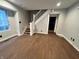 Living room with hardwood floors and a staircase leading to the upper level at 2918 Ruckle St, Indianapolis, IN 46205