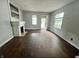 The living room is light and airy with a fireplace and two windows at 2918 Ruckle St, Indianapolis, IN 46205