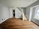 A view of the living room featuring stairs and original hardwood floors at 2918 Ruckle St, Indianapolis, IN 46205