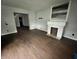 Living room with hardwood floors, a fireplace, and an open entryway visible at 2918 Ruckle St, Indianapolis, IN 46205