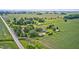 Expansive aerial view of a charming country home with verdant landscaping at 303 E County Road 500 N, Pittsboro, IN 46167