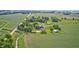 Scenic aerial shot showcases a beautiful rural property with lush farmland at 303 E County Road 500 N, Pittsboro, IN 46167