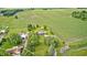 Expansive aerial view of a home featuring surrounding farmland and mature trees at 303 E County Road 500 N, Pittsboro, IN 46167