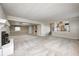 Large carpeted basement with fireplace, open access to the kitchen, and a neutral color palette at 303 E County Road 500 N, Pittsboro, IN 46167