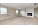 Spacious carpeted basement featuring a white brick fireplace, windows, and neutral paint at 303 E County Road 500 N, Pittsboro, IN 46167