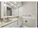 Bathroom featuring double sinks, a large mirror, and neutral decor at 303 E County Road 500 N, Pittsboro, IN 46167