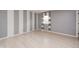 Stylish bedroom with neutral paint, light wood flooring, and a window for natural light at 303 E County Road 500 N, Pittsboro, IN 46167