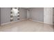 A well-lit bedroom features light wood flooring and a window allowing natural light at 303 E County Road 500 N, Pittsboro, IN 46167
