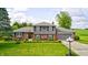 Charming two-story home with well-manicured front yard and attached two-car garage at 303 E County Road 500 N, Pittsboro, IN 46167