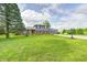Lovely two-story home featuring a beautifully landscaped lawn and mature trees at 303 E County Road 500 N, Pittsboro, IN 46167
