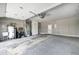 Spacious garage featuring storage, utility sink, and a door, ideal for projects and parking at 303 E County Road 500 N, Pittsboro, IN 46167