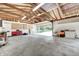 Large garage with workbench and storage is perfect for projects and parking at 303 E County Road 500 N, Pittsboro, IN 46167