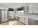 Kitchen with stainless appliances, custom desk area, and bright windows at 303 E County Road 500 N, Pittsboro, IN 46167